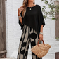 Set elegant cu top cu mâneci trei sferturi și pantaloni cu model